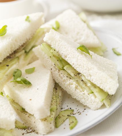 Cucumber & Mint Tea Sandwiches Recipe Cucumber Tea Sandwiches Recipes, English Tea Sandwiches, Cold Sandwich Recipes, Tartiflette Recipe, Tea Party Menu, High Tea Food, Cucumber Tea Sandwiches, Tea Sandwich, Tea Party Sandwiches