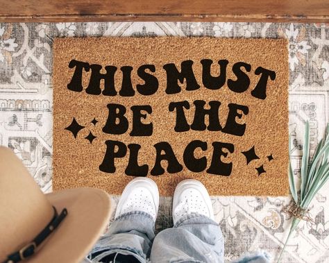 Apartment Front Door Aesthetic, Trendy Apartment Decor Bathroom, Cool Door Mats, Cute Door Mat, This Must Be The Place, Couples First Apartment Goals, Trendy Doormat, Apartment Door Mat, Apartment Front Door Decor