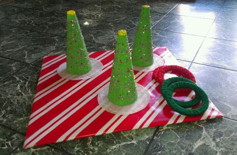 Christmas Tree ring toss! Diy Christmas Party Games, Preschool Christmas Party, Christmas Tree Game, Christmas Tree Ring, Christmas Party Games For Kids, Christmas Fair Ideas, Party Games For Kids, School Christmas Party, Christmas Party Activities