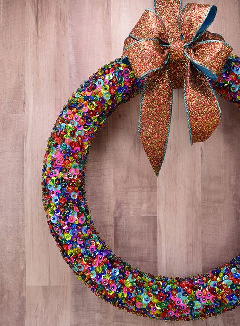 I remember when I was a kid my mom bringing out tons of little silver pins, colorful little beads, gorgeous and sparkly sequins and tons and tons of foam balls. You see I’ve always enjoyed making as has my mother and sister. Even when I was itty bitty I was a maker. Remembering these fun … Sequins Diy, Diy Christmas Wreath, Sequin Ornaments, Dollar Store Christmas Crafts, Sequin Crafts, Homemade Wreaths, Door Crafts, Fun Ornaments, Dollar Store Christmas