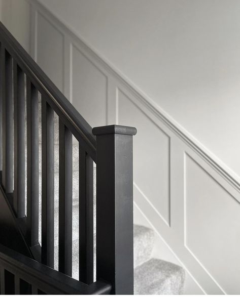 1930s Bannister Ideas, Black Panelling Stairs, White Hall Black Banister, Grey Staircase Panelling, Black Staircase Panelling, Hallway Panelling Black Stairs, Black Bannister Grey Carpet, Hall Stairs And Landing Decor, Stairway Makeover