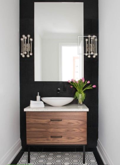 ✔ GUEST BATH: Large,vertical mirror to emphasize height (make room seem larger). Love the sconces, dramatic accent wall and complementing floor tile design! 12 WAYS TO MAKE BATHROOM LOOK BIGGER. Modern Powder Rooms, Monochrome Bathroom, Black And White Bathroom, Bilik Air, Powder Room Decor, Powder Room Design, Modern Toilet, Bad Inspiration, Downstairs Bathroom