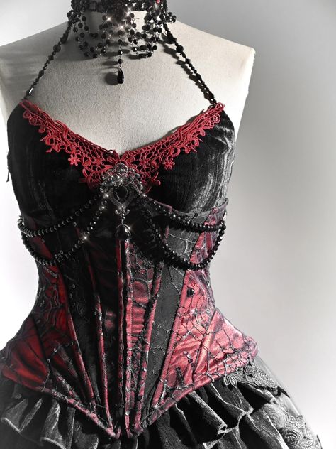 Exquisite Handmade Beaded Halter Neck Corset Top with Red Lace Applique – Featuring a V-Shaped Neckline and Slim Fit for a Captivating Vampire Look.   	 		 			Size 			S 			M 			L 			XL 		 		 			Bust 			83 			87 			91 			95 		 		 			Waist 			66 			70 			74 			78 		 		 			Hem Circumference 			74 			78 			82 			86 Vintage Luxury Corset For Costume Party, Luxury Vampire Style Outerwear For Costume Party, Luxury Gothic Bodice With Corset Back, Luxury Victorian Corset Dress For Costume, Luxury Gothic Halloween Costumes, Luxury Fitted Gothic Corset, Luxury Gothic Evening Corset, Black Overbust Corset Dress, Luxury Overbust Corset Dress For Formal Occasions