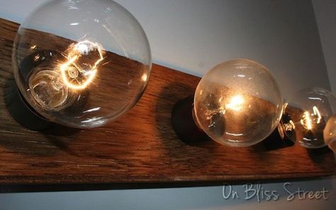 super easy hollywood light fixture upgrade for under 5, bathroom ideas, diy, how to, lighting, repurposing upcycling Hollywood Vanity Lights, Lighting Makeover, Rustic Kitchen Lighting, Diy Luminaire, Wood Light Fixture, Hollywood Lights, Diy Light Fixtures, Luxury Vinyl Tile Flooring, Vanity Light Fixtures