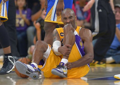 Kobe Bryant grimaces after being injured during a game against the Golden State Warriors on April 12, 2013, in Los Angeles. Bryant missed many games in his last few seasons because of his injuries.  — Mark J. Terrill / AP Kobe Bryant Injury, Achilles Tendon, Lakers Kobe, Nba Championships, Nba Season, Nba News, Love And Basketball, Shaquille O'neal, Basketball Player