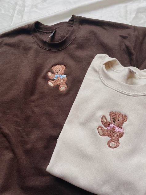 "Embroidered Teddy Bear Sweatshirt! -Embroidered on a cotton/polyester blend crewneck sweatshirt, this design is simple and minimalistic, perfect for every outfit! -Embroidery design measures 2.25\" x 3.5\". -See product pictures for shirt sizing chart. **SWEATSHIRTS ARE IN UNISEX SIZING AND RUN TRUE TO SIZE. -All sweatshirts are handmade on an embroidery machine so there may be slight differences, but we only sell the sweatshirts that meet our high-quality standards. -To maintain the quality of Crewneck Sweatshirt Embroidered, Teddy Bear Aesthetic Clothes, Clothes Selling Pictures Aesthetic, Back Of Sweatshirt Designs, Cute Bear Design, Embroidery On A Sweatshirt, Cute Embroidery Designs Sweatshirts, Sweater Ideas Design, Cute Tshirt Designs For Women