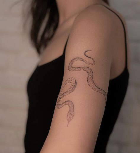 Ball Python Wrapped Around Arm Tattoo, Upper Arm Snake Tattoos For Women, Witch Snake Tattoo, Snake Arm Cuff Tattoo, Snake Line Art Tattoo, Rattlesnake Tattoo Feminine, Eve Snake Tattoo, Snake Arm Band Tattoo, Wrap Snake Tattoo