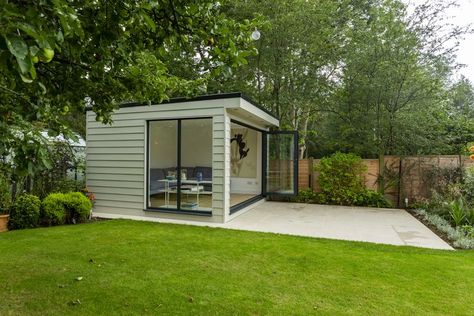 Looking for a Garden Room with the Wow Factor? Look no further then this gorgeous garden building. This simple design has created a luxurious additional family room for our customers in Haywards Heath. The square shaped building has aluminium bi-fold doors which connect the room to the surrounding garden beautifully. Sitting at 3.5x3.5m and cladded in hardie plank weatherboard by James Hardie this fibre cement cladding is incredibly durable and has the benefit of being maintenance free. Cement Cladding, Fibre Cement Cladding, James Hardie, Hardie Plank, Garden Studio, Garden Buildings, Gorgeous Gardens, Bifold Doors, At Home Gym