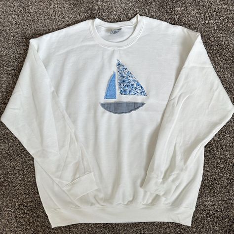 Gildan Heavy Blend crewneck with a patchwork sailboat hand-sewn by me using fabric scraps. - Crewneck color: white - Unisex - Size up for an oversized fit! - Content: 50% Cotton, 50% Polyester - Care: machine wash, cool, non-chlorine bleach when needed, tumble dry, medium, do not iron, do not dry clean Sailboat Patchwork Sweatshirt, Cute Diy Crewnecks, Making Sweatshirts With Friends, Sewing Sweatshirts Diy, Diy Crewneck Sweatshirt Ideas, Sewn Sweatshirt, Diy Hoodies, Diy Hoodie, Beachy Clothes