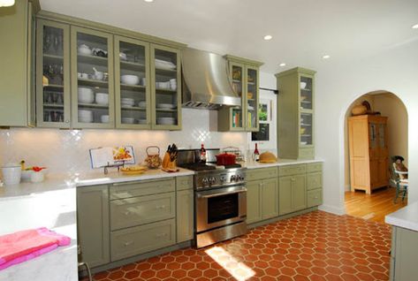 Spanish Revival Kitchen, Red Tile Floor, Omega Cabinetry, Terracotta Kitchen, Spanish Style Kitchen, Kitchen Cabinet Color Ideas, Spanish Bungalow, Sage Green Kitchen, Green Kitchen Cabinets