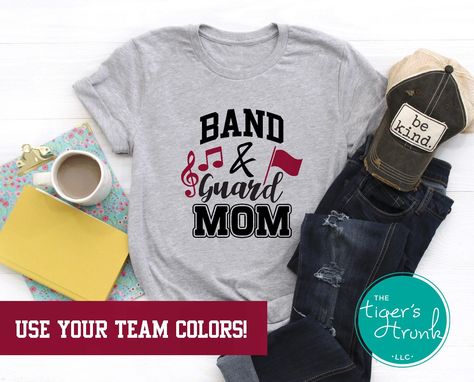 "Show your team spirit and pride with these adorable Band & Guard Mom shirts! These shirts can be personalized with your team colors. They make a perfect gift for your favorite Mom--or go ahead and treat yourself! *This is a unisex fit short-sleeve shirt. All of our shirts are made with high quality, durable vinyl that has been applied with a professional quality heat press. *Select your Shirt Size and Shirt Color in the Dropdown Menus. Use the photos labeled Shirt Color to pick your shirt color Color Guard Mom, Color Guard Shirts, Theater Director, Marching Band Mom, Band Gifts, Theatre Shirts, Band Mom, Drama Club, Senior Night