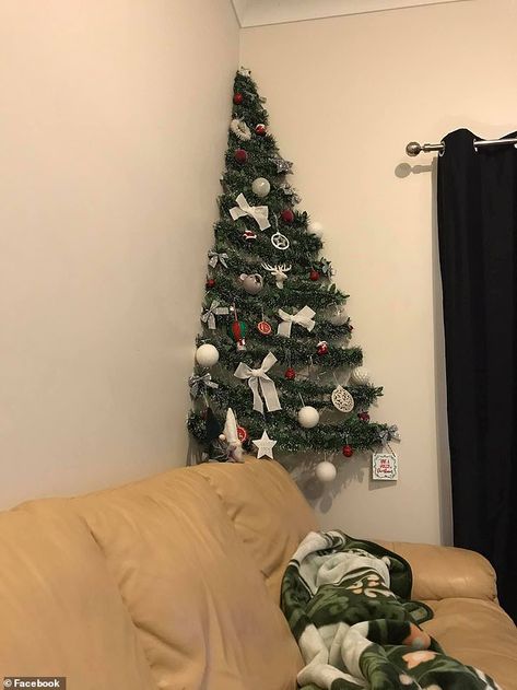 An Australian mum who couldn't spare the space for a traditional Christmas tree in her small apartment has created an eye-catching two-dimensional replacement. Christmas Tree In Small Living Room, Corner Wall Christmas Tree, Alternate Christmas Tree, Tiny Christmas Tree Ideas, Christmas Tree For Small Spaces, Space Saving Christmas Tree, Alternative Christmas Tree Diy, Trees For Small Spaces, Small Space Christmas Tree