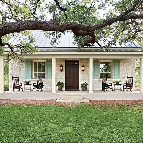 This casual Hill Country cottage pours on the Southern charm with its familiar farmhouse form, picture-perfect proportions, and inviting front porch nestled beneath a curtain of large oak trees. The stone facade and metal roofing nod back to Fredericksburg's original German-style architecture. We'd love to kick up our feet and wind down our week in this soulful country home. Texas Farmhouse, Stone Facade, Farmhouse Front Porches, Small Farmhouse, Farmhouse Cottage, Rocking Chairs, Cottage Design, Hus Inspiration, The Porch