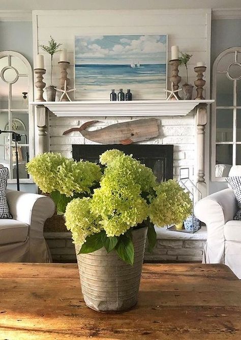 Fireplace decor ideas for those who love the sea. Some simple coastal and nautical ideas for your fireplace. Featured on Completely Coastal. Bathroom Rustic Decor, Coastal Fireplace Ideas, Beach House Fireplace, Coastal Mantle Decor, Beach Fireplace, Hearth Decor, Coastal Fireplace, Wood Whale, Farmhouse Mantle Decor