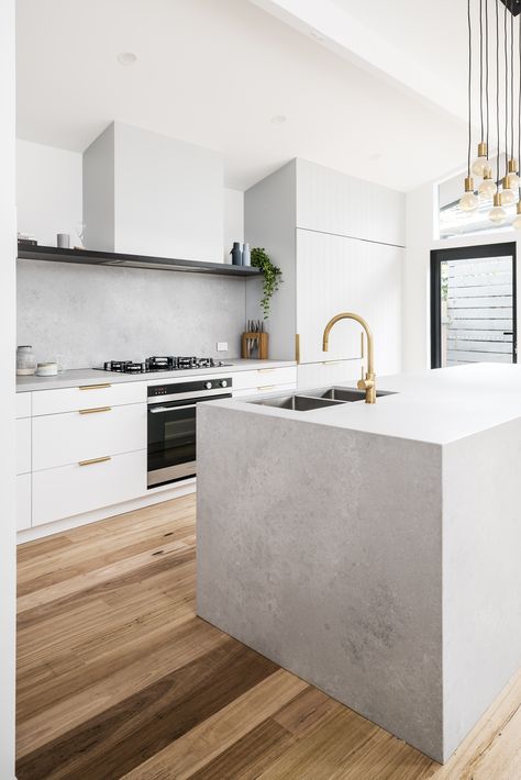 Today's inspiration comes from this project on Oliver’s hill Frankston South by @tuxluxnet! The Raw Brushed Brass and brass cabinet handles create the perfect amount of colour against the cool concrete @ceasarstone benchtops and neutral cabinetry.  Product featured: 30694-91 Pegasi M Sink Mixer Curve, Pull Out, Raw Brushed Brass  #faucet #faucetstrommen #kitchen #design #kitchendesign #modernkitchen #whitekitchen #paneledwalls #concrete #concretecountertops #rawbrushedbrass #brasstapware #brass White Concrete Kitchen, Concrete Benchtop, Caesarstone Kitchen, Scandi Kitchen, Timber Kitchen, Kitchen Benchtops, Concrete Countertops Kitchen, Brass Sink, Concrete Kitchen