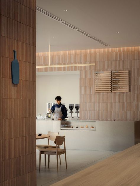 Locally produced tiles clad walls and table in Blue Bottle Coffee shop Parisian Style Interior, Brick Cafe, Keiji Ashizawa, Tile For Wall, Aesthetic Furniture, Wall Lamp Shades, Blue Bottle Coffee, Hotel Floor, Tile Manufacturers