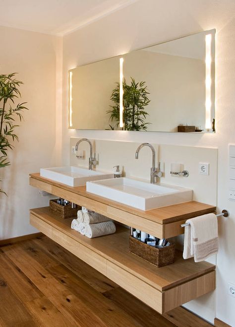 Bathroom Design Ideas - Open Shelf Below The Countertop // Dual sinks sit above a floating wooden shelf that's just the right height to store various lotions, potions, and creams as well as a stack of towels. Bathroom Storage Hacks, Bad Inspiration, Small Bathroom Storage, Trendy Bathroom, Bad Design, Bathroom Renos, Bathroom Shelves, Diy Bathroom, Amazing Bathrooms