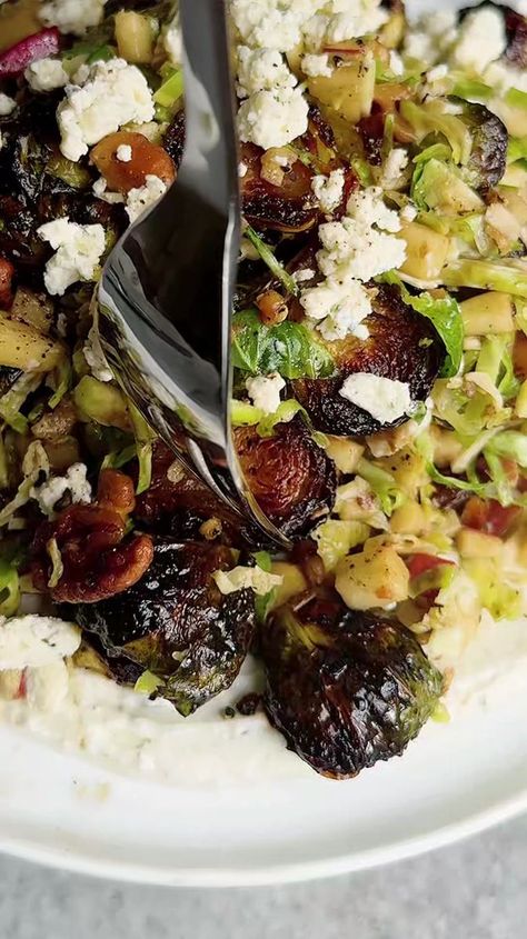 3.1K views · 81 reactions | CRISPY & CRUNCHY BRUSSELS SALAD WITH APPLES & BOURSIN CREAM! A little roasted, a little raw, a LOT of flavor! • For the salad: 1 1/2 lb brussels, trimmed/halved (divided) 5 tbsp olive oil, divided 1/2 tsp salt 1/2 tsp garlic powder 1/2 tsp paprika 1 tbsp honey or maple syrup 1 apple, finely chopped • For the walnuts: 1/4 cup walnuts Olive oil Salt • For the dressing: 1 1/2 tbsp balsamic vinegar 1 1/2 tbsp honey or maple syrup 1 tbsp olive oil 1/2 tbsp dijon mustard 1/2 tsp salt Pepper to taste • For the boursin: 1/2 block of boursin cheese (2 1/2 oz), plus more for topping 1/3 cup Greek yogurt • Preheat oven to 450. Place a sheet pan in the oven while it preheats.Place 1/3 of the brussels sprouts onto a cutting board & finely slice, then set aside. Make the crea Brussels Salad, Salad With Apples, Boursin Cheese, Brussels Sprouts, Sheet Pan, Brussels, Sprouts, Apples, Salad