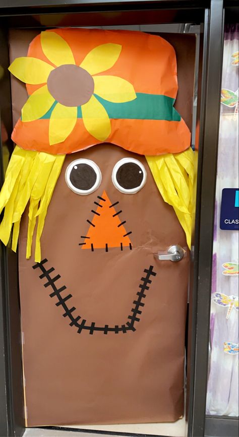 Fall Festival Ideas For Adults, School Fall Festival Ideas Decoration, Library Scarecrow Ideas, Scarecrow Door Classroom, Fall School Door Decorating Ideas, Scarecrow Door Decoration, Classroom Scarecrow, First Grade Fall Door Decorations, Fall Tree Door Decorations Classroom