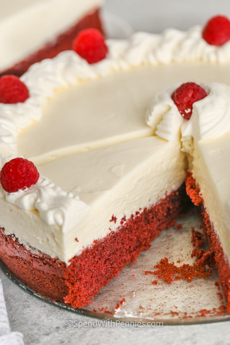 We love the combination of red velvet cake and rich & creamy cheesecake! This easy-to-make recipe is such an impressive dessert, serve it for dessert after a dinner party & watch it disappear! Short on time? Bake it the day before so it's ready to serve! #easyredvelvetcheesecake #redvelvetcheesecake #redvelvelvetcheesecakerecipe #spendwithpennies Red Velvet No Bake Cheesecake, Easy Red Velvet Cheesecake, Simple Red Velvet Cake, Red Velvet Cheesecake Recipe, Cheesecake Cups Recipe, Red Velvet Cheesecake Cake, Easy Red Velvet, Impressive Dessert, Boxed Cake Mixes Recipes