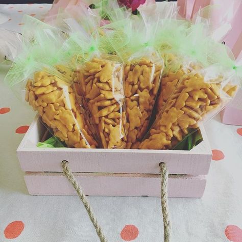 Cheddar bunny party favors from the "Some Bunny is One" birthday party.  Organic cheddar bunnies in cone shaped plastic bags tied with ribbon.  So easy and cheap.  #firstbirthday #somebunnyisone #confettiandwishes #eventplanning #eventplanner #eventstyling #eventprofsuk #eventprofs #meetingplanner #meetingplanner #meetingprofs #inspiration #popular #trending #eventplanning #eventdesign #eventplanners #eventdecor #eventstyling #micefx #meeting #planners #international [Visit www.micefx.com fo... Bunny Theme Party Favors, Some Bunny Is One Party Favors, Bunny Birthday Party Favors, Bunny Centerpieces Birthday Parties, Some Bunny Is One Birthday Party Ideas, Somebunny Is One Birthday, Somebunny Is Turning One, Bunny Party Favors, Some Bunny Is Two