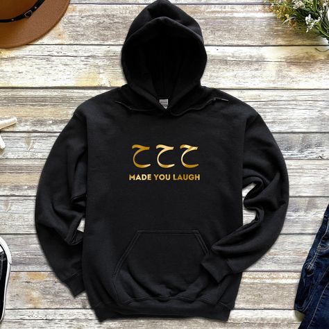 All of our apparel is made with with a premium blend of cotton and polyester for true softness and comfort. Look great and feel even better knowing that you're getting the best quality fabrics and designs around. * Standard US Size (True-to-Fit) * High Quality Fabric * Durable and Long Lasting MORE OPTIONS This design is available as a Hoodie, Sweatshirt, T-Shirt, Toe Bag, Mug, and more! Please message us on Etsy if you can not find what you are looking for.Made with a premium blend of cotton and polyester for true softness and comfort. Look great and feel even better knowing that you're getting the best quality fabrics and designs around. * Standard US Size (True-to-Fit) * High Quality Fabric * Durable and Long Lasting QUALITY All of our apparel is hand checked for absolute precision. We Arabic Hoodie, Love In Arabic, Muslim Holidays, Arabic Names, Letter Sweatshirt, Eid Ramadan, Muslim Men, Eid Gift, Ramadan Gifts