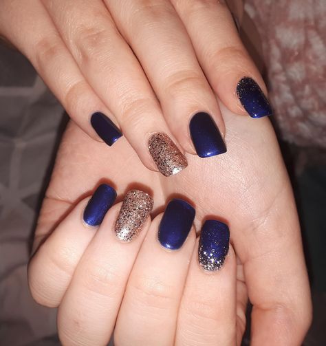 Blue And Champagne Nails, Navy Blue New Years Nails, Navy Nails With Gold, Navy Blue And Rose Gold Nails, Nude And Navy Nails, Navy And Rose Gold Nails, Champaign Nails, Dark Blue Nails With Glitter, Blue And Gold Nail Designs