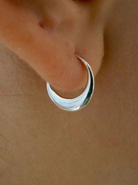 * Tiny Tribal Sleeper Earrings.  * Quantity '1' = one pair of hoops * Inner Hoop Diameter = 9mm * Outer Measurements = 12mm wide x 12mm tall. Elegant and simple little petal earrings that hug the earlobe. .There is an organic curve and taper to these lovely little petals; an artistic depth and dimension. Wear them in your septum, cartilage, tragus, or daith. OPTIONS: 1. Solid 925 Sterling Silver 2. Gold-tone (brass) petals with solid 925 sterling silver ear-wires. WHAT ARE SLEEPER HOOPS? Sleeper Sleeper Earrings, Crescent Moon Earrings, Daith Piercing, Moon Earrings, Everyday Earrings, Jewelry Inspo, Jewelry Earrings Hoops, Tragus, Silver Hoops