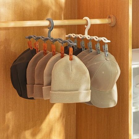 Description: Featuring its light weight and small size, this hat hanger is easy to use and change place, which is practical and stable. By using this hat hanger can help to keep your wardrobe tidy and save space, which is convenient and useful. It is made of high-quality PS and PP material. The length of this hat hanger is 38.7cm and width is 13cm. It is suitable for storage cloth, hat, baseball hats, cowboy hat, bucket hat and other hats. Item Name: Hat Hanger Material: PS, PP Features: Easy to Hang Sweaters, Space Saving Bedroom, Hanging Hats, Space Saving Hangers, Hat Organization, Hanger Clips, Hat Hanger, Hat Holder, Hat Storage