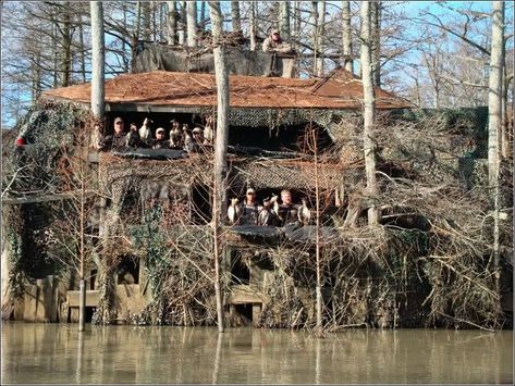 Deluxe duck blind house- "2nd level has a full kitchen with fridge, 2 stoves, electricity for lights, living room with 2 couches and satellite TV, theater seats around the "porch of the blind" to sit 14 guys comfortably. A side porch has a running toilet, a stainless steel grill for cooking whole rib-eyes for lunch and a bar to make all the Mojos and margarita machine which are hardwired to car batteries. 3rd level is the "crows nest" with room for 3. It's about 25' up in the trees and most of Duck Hunting Man Cave, Duck Blinds, Fantasy Dwellings, Duck Hunting Blinds, Hunting Stands, Twig Furniture, Deer Blind, Duck Blind, Goose Hunting