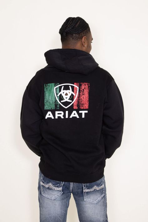 This Ariat Mexico Shield Hoodie for Men in Black is ultra-soft and supremely comfortable. This hoodie features a screen printed red and green Ariat graphic on the back, brushed fleece, and a kangaroo pocket. Features: Ariat Style: 10042745-BLACK Color: Black 60% Cotton, 40% Polyester Brushed fleece Screen printed red and green Mexico Flag and Ariat logo graphic on back Ariat logo on left chest Ribbed hem and cuffs Hood with adjustable draw cord Kangaroo pocket Measurements from a size large: Len Ariat Logo, Racing Horse, Mexico Flag, Men In Black, Hoodie For Men, Outdoor Clothing, Outdoor Outfit, Logo Graphic, Jean Shirts