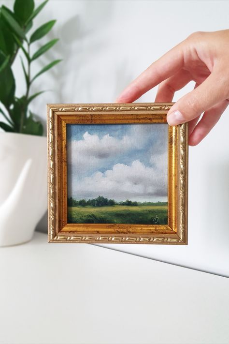 Introducing a stunning miniature landscape painting that will instantly transport you to a serene world of natural beauty. This exquisite artwork is carefully crafted on a canvas panel, capturing the essence of a picturesque landscape. The gold frame elegantly complements the painting, adding a touch of sophistication to any space. Display it on your mantel, shelf, or gallery wall to create an enchanting focal point that will captivate everyone who lays eyes upon it. Small Painting Big Frame, Small Framed Paintings, Nature Oil Painting Landscapes, Framed Paintings On Wall, Small Oil Paintings, Tiny Paintings Ideas, Mini Landscape Paintings, Small Art Gallery, Miniature Landscape Painting