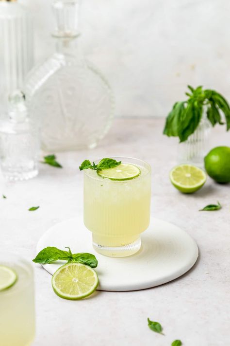 This gin basil smash is a super light, refreshing cocktail that's perfect for sipping all summer long! With botanical gin, basil simple syrup, and tart lime juice, it'll be sure to please any cocktail lover! Gin Basil Lemonade, Basil Lime Cocktail, Basil Cocktail Recipes, Basil Gin Cocktail, Cocktail Shoot, Fun Coffee Drinks, Recipes For Fun, Lime Cocktails, Basil Gimlet