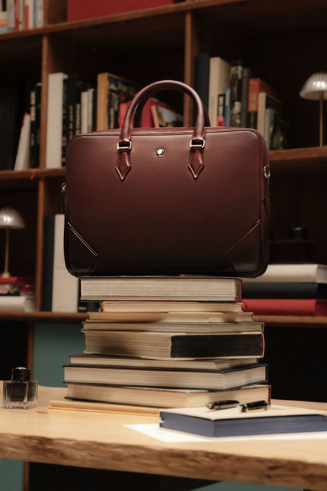 Sophisticated and seductive, the sfumato effect is unique to the Meisterstück leather range. Inspired by the patina on heritage ink bottles, this elegant and contemporary finish is applied by hand, softly transitioning leather bags and accessories from dark at the base to lighter tones at the top. Montblanc Bag, Bag Packs, Briefcase Bag, Leather Making, Business Case, Mens Leather Bag, Bags And Accessories, Suitcases, Accessories Store