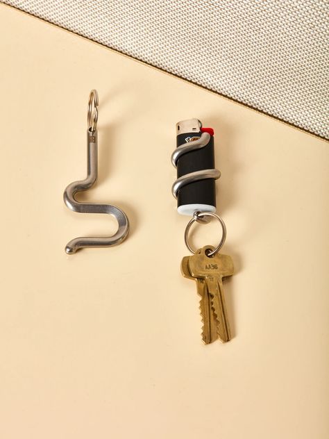 serpent keychains – Coming Soon Lighter Holder, Bic Lighter, Ceramic Vessels, Fotografi Vintage, Decorative Elements, Ceramic Vessel, Light Holder, Jewelry Inspo, Everyday Carry