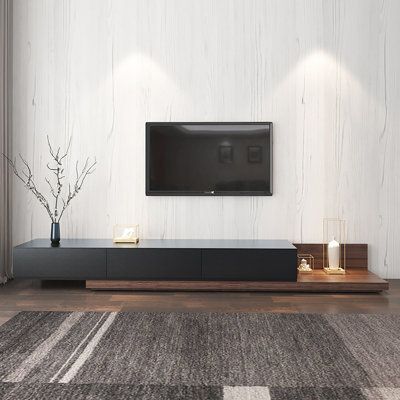 Enhance the elegance of any room with our modern and luxurious TV stands. The sleek design, featuring clean lines and a minimalist aesthetic, is perfect for contemporary homes. Experience the perfect blend of style and functionality. | Hokku Designs Dynalee 63" W Storage Credenza Wood / Metal in Black / Brown, Size 11.4 H x 63.0 W x 15.7 D in | Wayfair Wooden Media Unit, Wood Corner Tv Stand, Wood Media Console, Wooden Tv Cabinet, Black Tv Stand, Wood Tv Cabinet, Living Tv, Desain Furnitur Modern, Corner Tv Stand