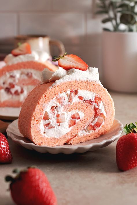 This strawberry swiss roll cake is made with a soft and fluffy chiffon cake wrapped around airy whipped cream and fresh strawberries. It's a pretty pink cake that tastes like you're eating a cloud! #swissroll #rollcake #strawberrycake #chiffoncake | teakandthyme.com Strawberry Swiss Roll, Easter Strawberry, Strawberry Roll, Swiss Roll Cakes, Strawberry Roll Cake, Swiss Rolls, Easter Cupcake, Swiss Roll Cake, Cake Rolls