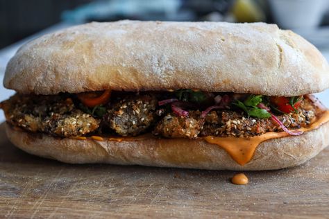 Call it a schnitzel or a giant nugget, this breadcrumb coated aubergine goes perfectly with harissa mayo and herby salad in our first sarnie drop of the season. We’ve managed to turn one whole aubergine into a cutlet by roasting, steaming and peeling off the skin. Inspired by the technique for making baba ganoush, this is the best way to get your inner schnitzel soft and juicy Bosh Recipes, Harissa Mayo, Herby Salad, Schnitzel Sandwich, Chinese Lemon Chicken, Roast Pumpkin Soup, Curry Stew, Eggplant Salad, Baba Ganoush