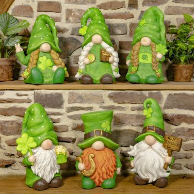 Let the shenanigans begin with "The Shamrocks". Featuring six assorted St. Patrick's Day themed gnomes, this collection is a must have for any good Irish person. One of the few collections that includes both male and female gnomes, each little leprechaun is full of personality and style. All are dressed in their St. Paddy's Day green, with either white or red/orange hair, embellished with their own holiday accents such as three leaf clovers and a pint of beer. | Zaer Ltd International "The Shamr Female Gnomes, Themed Gnomes, Gnome Ideas, Red Orange Hair, Female Gnome, Let The Shenanigans Begin, Garden Friends, Three Leaf Clover, How To Make Decorations