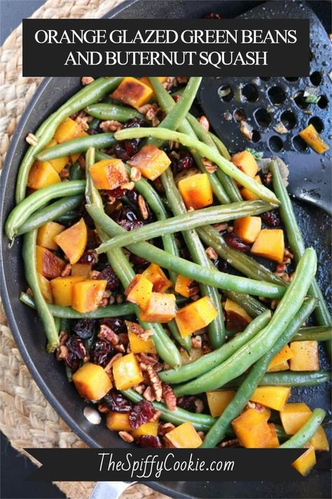 This dish is healthy and flavorful. It features green beans and butternut squash glazed with orange juice and a touch of honey. The orange juice adds a tart sweetness to the dish, while the honey brings out the natural sweetness of the butternut squash. This dish is perfect for a healthy Thanksgiving feast! #HolidaySideDish #thespiffycookie #greenbeans #butternutsquash #thanksgivingrecipes #skilletrecipe Butternut Squash And Green Beans Recipes, Green Bean And Butternut Squash Recipe, Glazed Green Beans, Vegetables Casserole, Green Beans With Cranberries, Baked Beans With Bacon, Loaded Cauliflower Casserole, Roasted Artichoke, Herb Stuffing