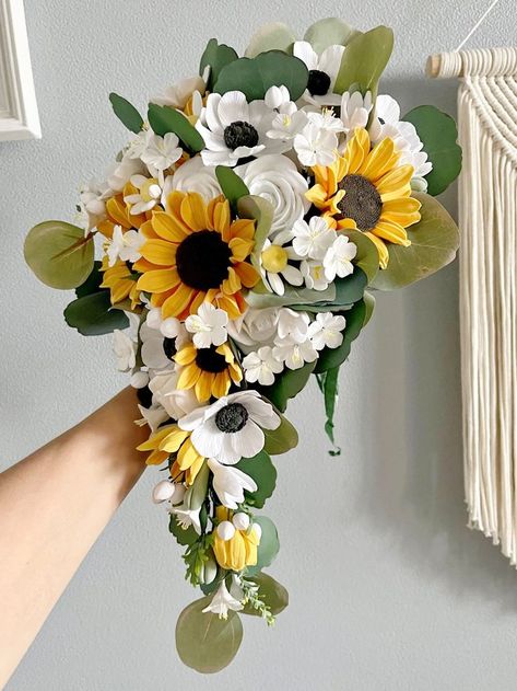 Cascading bridal bouquet of sunflowers by LoveClayFlowers. Sunflower and cherry blossom wedding bouquet, Cascade sunflower wedding bouquet. Wedding accessories set: bouquets, boutonnieres and corsages. Stunnin cascading sunflowers and cherry blossoms bouquet , all flowers are handmade of clay , bouquet consists of sunflowers, anemones, daisies, cherry blossoms, buds, eucalyptus #rusticwedding #weddingideas Cherry Blossom Wedding Bouquet, Wedding Bouquet Cascade, Rustic Wedding Veil, Clay Bouquet, Cherry Blossom Bouquet, Bouquet Cascade, Wedding Succulents, Succulent Wedding Decor, Blossom Wedding