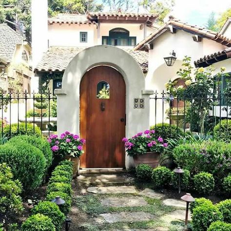 What a beautiful Spanish cottage. #homeexterior #exterior #garden #landscape #spring #springgarden #spanishhome #cottage #tileroof Spanish Cottage, Mediterranean Homes Exterior, Mediterranean Exterior, Mediterranean Mansion, Spanish Bungalow, Mediterranean Architecture, Mediterranean Style Homes, Backyard Privacy, Mediterranean Home Decor