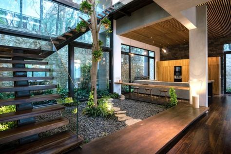 Nature-inspired Teak House welcomes Vietnam’s forests indoors | Inhabitat - Green Design, Innovation, Architecture, Green Building Indoor Courtyard, Industri Modern, Rustic Outdoor Decor, Industrial Home Design, Courtyard Design, Interior Plants, Earthship, Courtyard House, Interior Garden