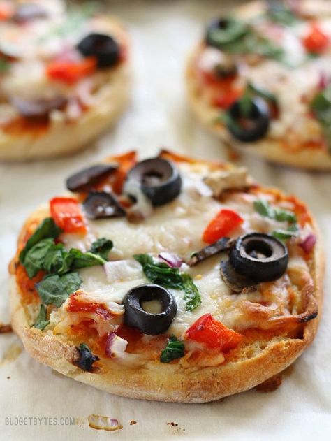 Freezer Ready Mini Pizzas are an easy and inexpensive snack to keep on hand in your freezer. BudgetBytes.com Inexpensive Snacks, Budget Freezer Meals, Freezer Friendly Meals, Make Ahead Freezer Meals, Budget Bytes, Freezer Meal Prep, Mini Pizzas, Freezer Cooking, Mini Pizza