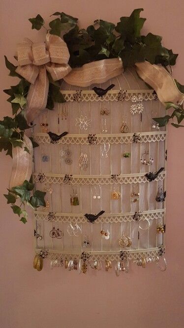 Leslie's homemade earring holder I made this myself out of a piece of screen a metal wall birdcage, vine ivy, and ribbon all from Michaels craft store Homemade Earring Holders, Earring Holders, Victoria Kay, Michaels Craft, Diy Jewelry Holder, Crafts Room, Titanium Wedding Band, Diy Crafts Room Decor, Earring Holder