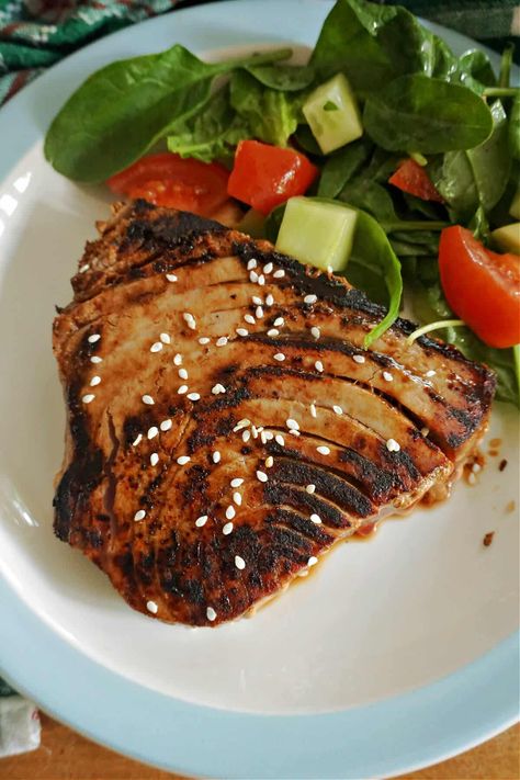 Pan-Seared Tuna Steaks in a fragrant soy sesame marinade, a quick and easy restaurant-style dinner recipe that is incredibly delicious and cooked to perfection. A fantastic gourmet dish for seafood lovers, these tuna steaks pair wonderfully well with a light salad of some vegetables. Recipe Tuna Steak, Healthy Tuna Steak Dinner Recipes, Pan Fried Tuna Steak, Yellow Fin Tuna Recipes Steak, Tuna Steaks Recipes, Blackened Tuna Steak, Yellow Fin Tuna Recipe, Fresh Tuna Steak Recipes, Tuna Steak Dinner