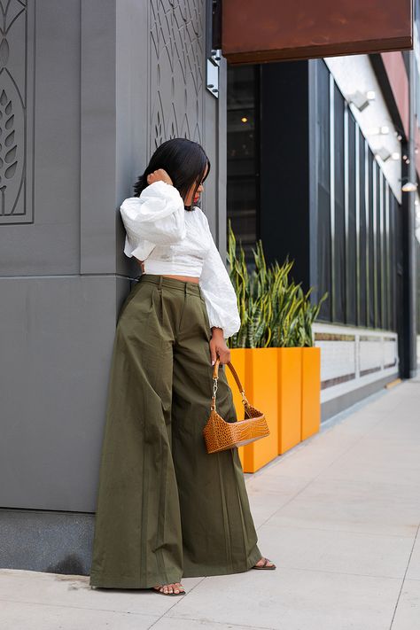 high waisted green pants with cult gaia white crop top Kakis Wide Leg Pants Outfit Women Style, Highwaist Wideleg Pants Outfit, How To Style Green Wide Leg Pants, Bodysuit And Wide Leg Pants, Extra Wide Leg Pants Outfit, Big Trousers Outfit, Modest Cargo Pants Outfit, Khaki Wide Leg Pants Outfits, Wide Leg Dress Pants Outfit