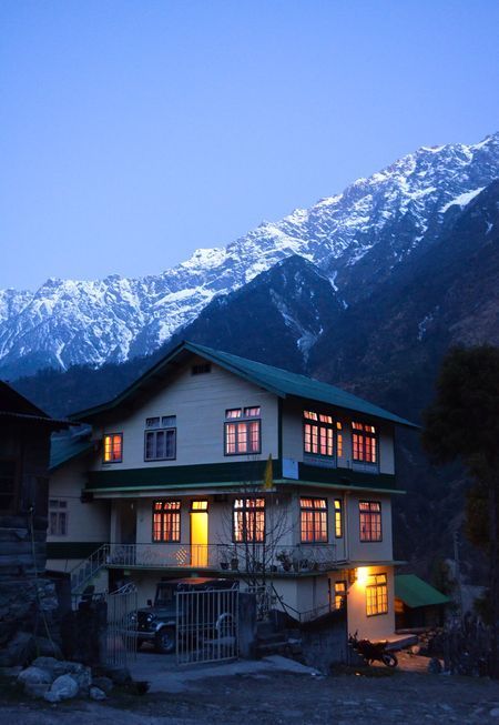 I took this picture early morning ,in a beautiful village in north sikkim called Lachung, of a house well lit to beautifully portray the massive snow mountain in the background. North Eastern India, North East India Aesthetics, North Sikkim Photography, North Sikkim, Travel Destinations In India, India House, India Travel Places, Mountains Photo, Anime House