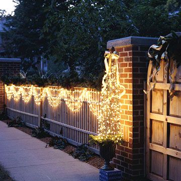 Using your Christmas lights as light swags is a beautiful (and cheap!) way to dress up your front yard! More lighting ideas: http://www.bhg.com/christmas/outdoor-decorations/outdoor-christmas-lights/?socsrc=bhgpin121313swagsoflight&page=24 Outdoor Lighting Design, Diy Outdoor Lighting, Christmas Lighting, Fence Lighting, Backyard Entertaining, Golden Gate Park, Xmas Lights, Christmas Yard, Deck Lighting