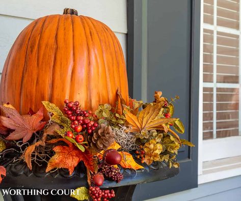 A guide to the easiest secrets to decorating a large front porch for fall that creates a cozy space that oozes with warmth and charm. Fall Porch Pots With Pumpkins, Fall Pots Outdoor Planters With Pumpkins, Fall Flower Pots With Pumpkins, Fall Planter Ideas Front Porches, Faux Fall Outdoor Planter, Fall Planters Front Porches, Outside Fall Decorations Front Yards Pots & Planters, Front Porch Planters, Deck Dining